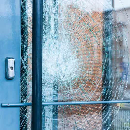 Shattered glass held intact by safety window film, demonstrating shatter resistance